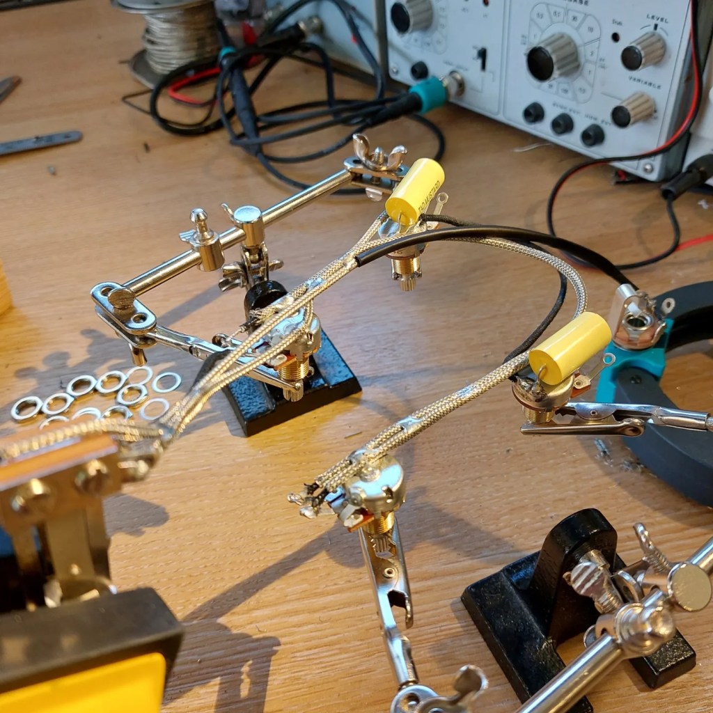 Picture of guitar components being wired together